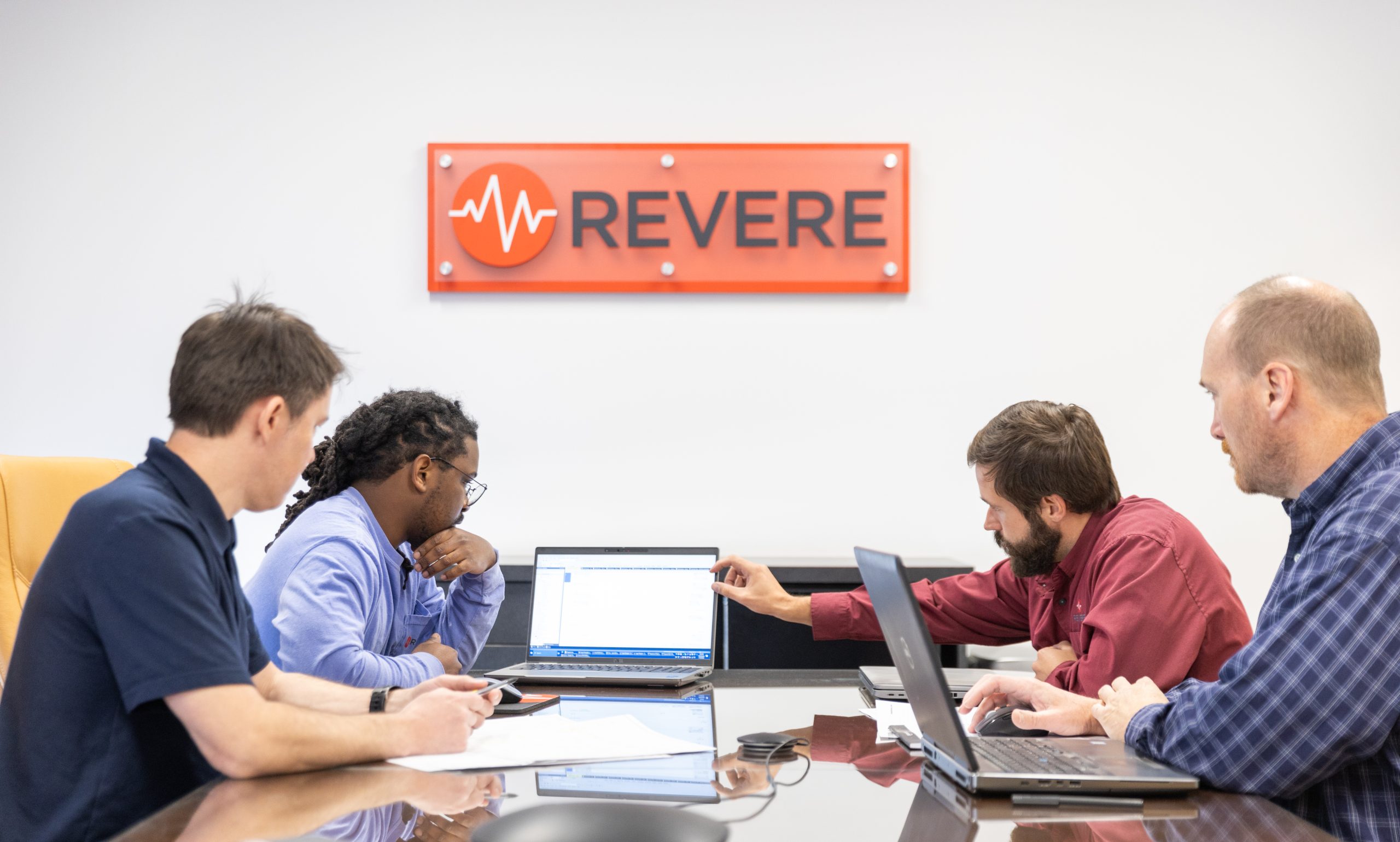 the Revere team strategizing in a meeting room