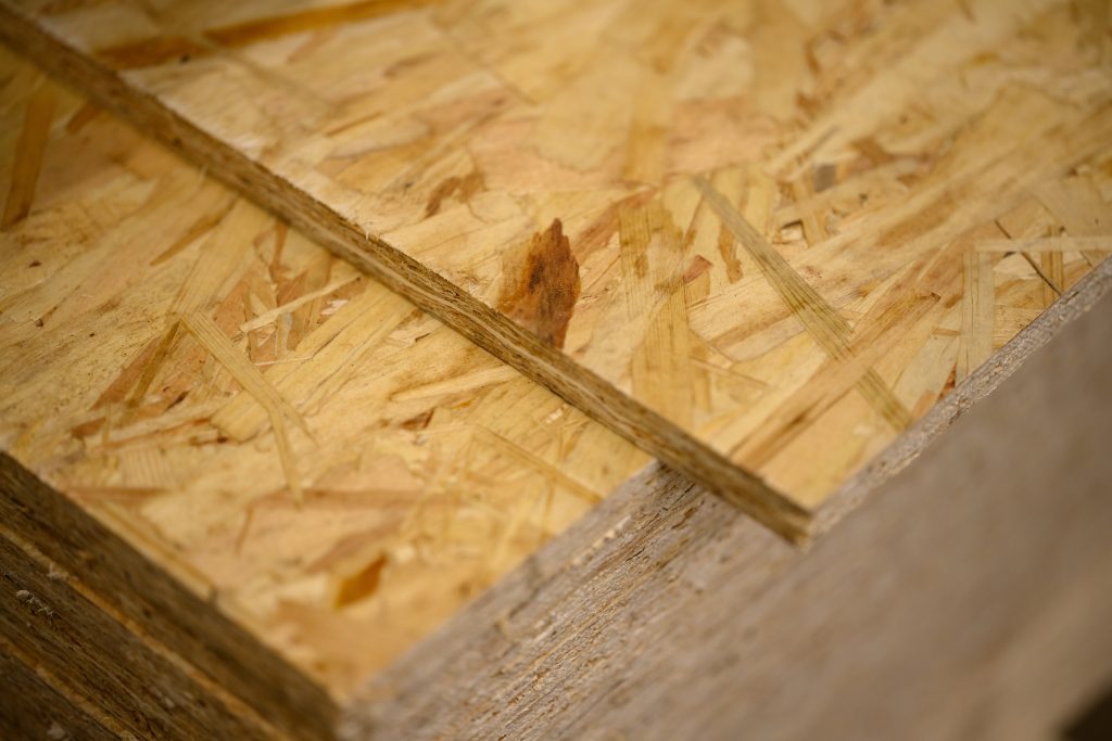 A stack of OSB sheets stacked one on another